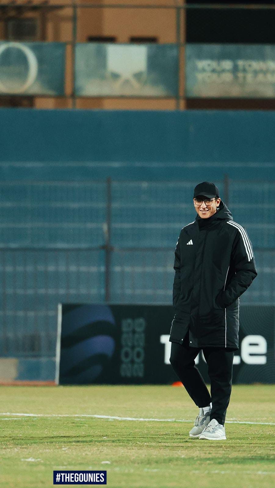 Graduate on Egyptian pitch at night