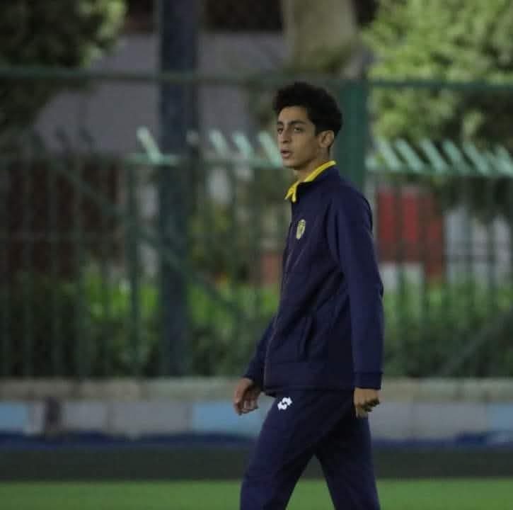 Young graduate coaching on pitch