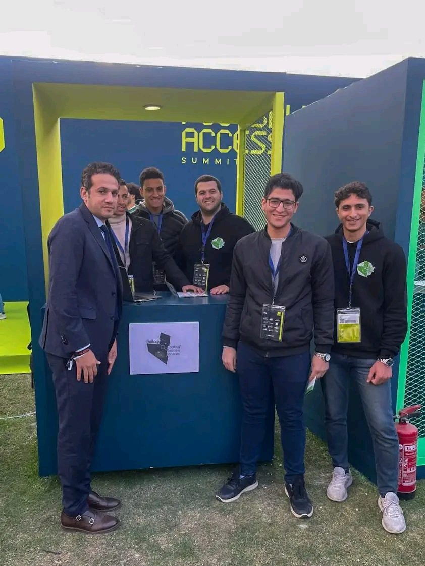 Team at BFAS booth with sign