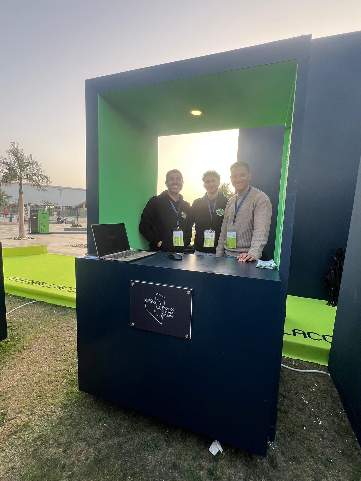 Team at BFAS booth at sunset