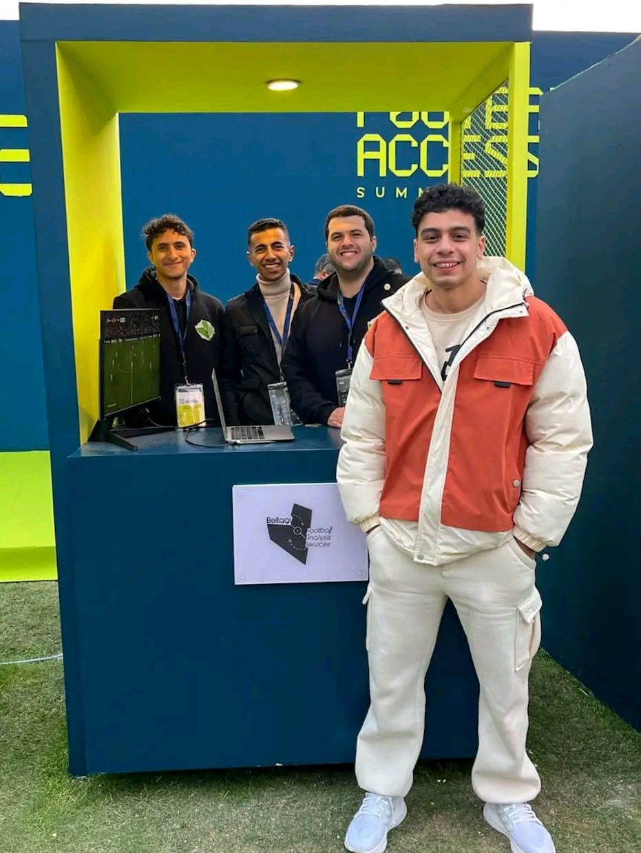 Team at booth with visitor